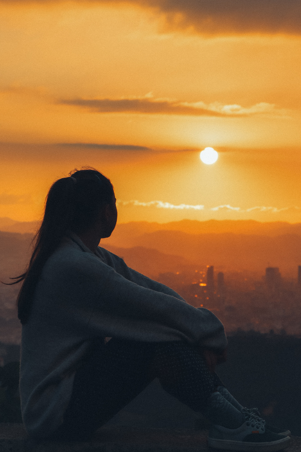 A woman contemplates her struggle